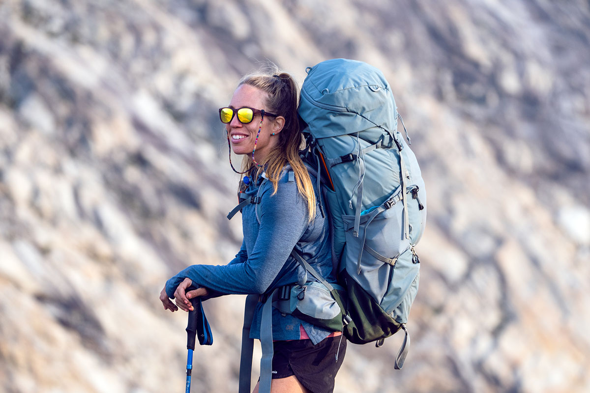 Osprey || Icebreaker || Patagonia Butikk -Osprey || Icebreaker || Patagonia Butikk Smiling wearing Deuter Aircontact Core womens backpacking backpack